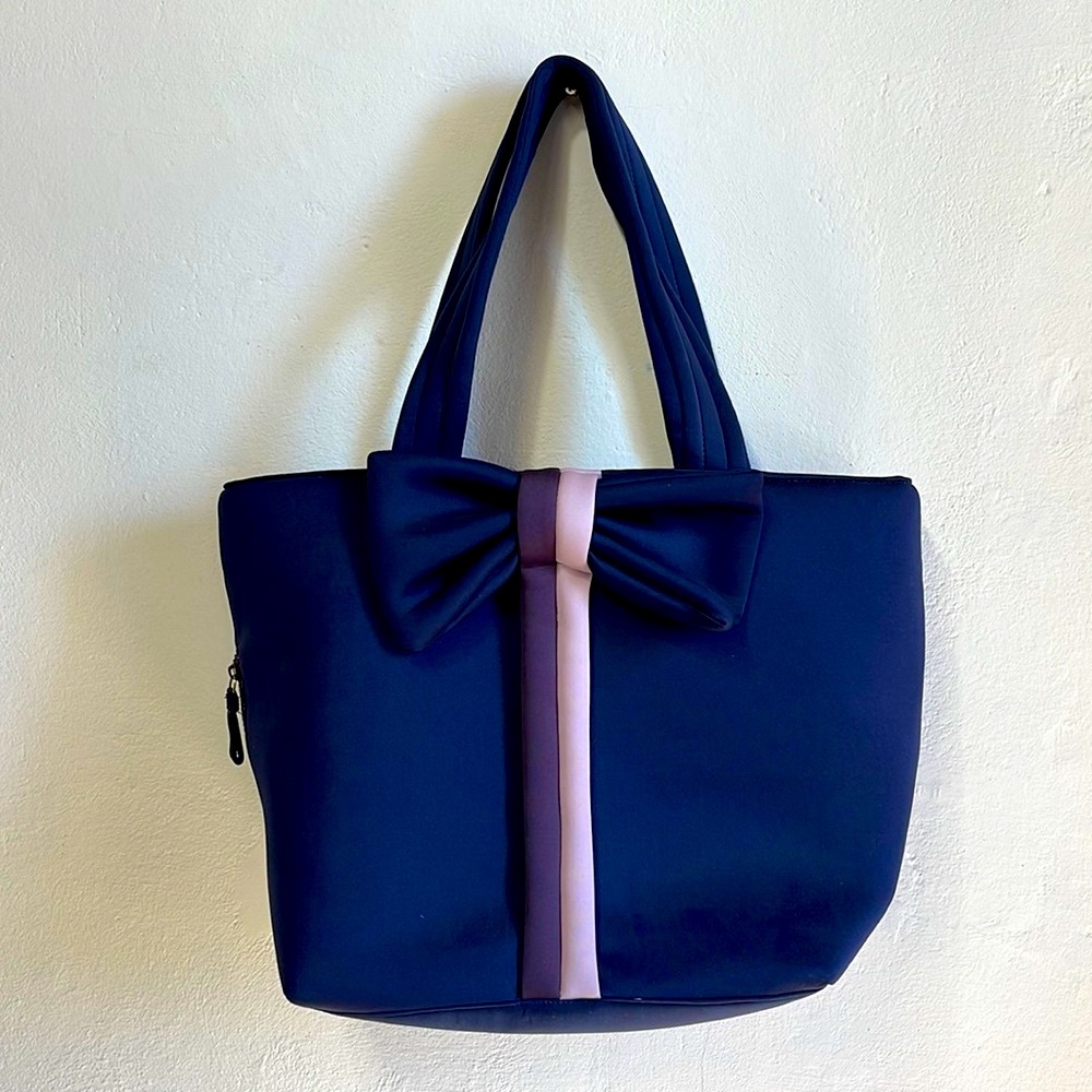 Navy blue shoulder bag with large bow by Stella and dot